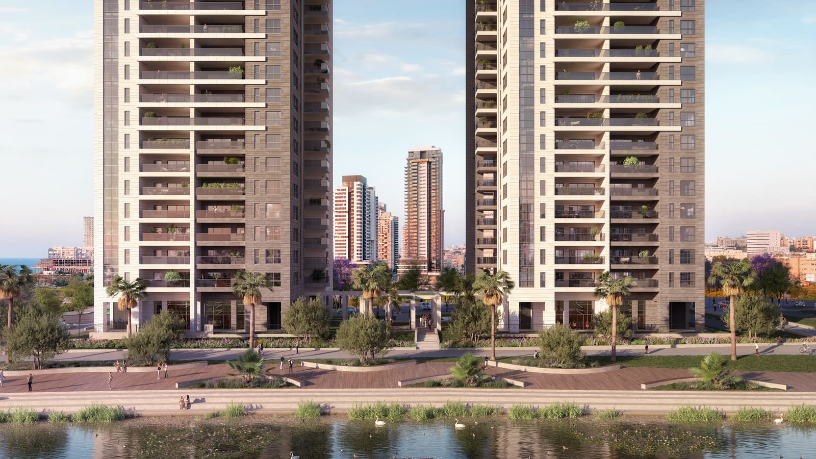 הדמיה של Sea & Park מעבר לאגם בפארק בשעת השקיעה: שני המגדלים, העיר מאחוריהם ורצועת ים בקצה